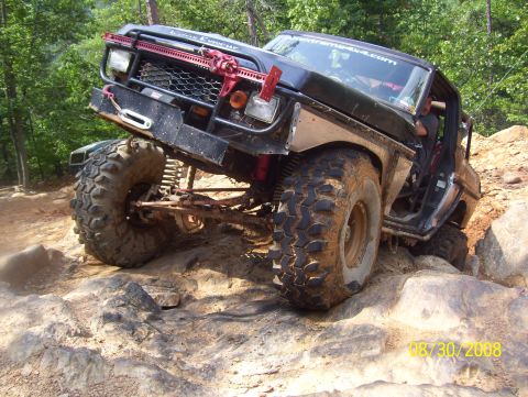 1978 Ford Bronco - This modified 1978 Ford Bronco navigates a rocky trail with its suspension articulated.