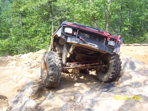 1978 Ford Bronco - Modified 1978 Ford Bronco navigating a rocky trail during an off-road event.