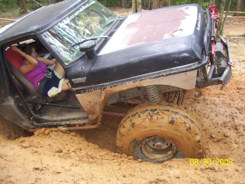 1978 Ford Bronco - A 1978 Ford Bronco is stuck deep in mud during an off-road excursion.