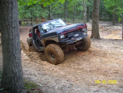 1978 Ford Bronco - This modified off-road vehicle navigates a muddy trail on August 30, 2008.