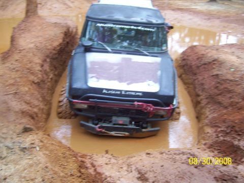 1978 Ford Bronco - A black SUV navigates a muddy off-road obstacle on August 30, 2008.