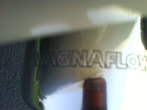 2003 Ford Crown Victoria - Close-up of a Magnaflow exhaust component, showing embossed branding.