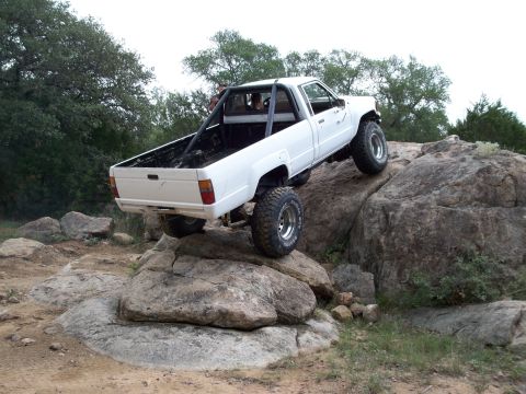 1996 Ford Bronco - This lifted Toyota pickup navigates a rocky off-road course.