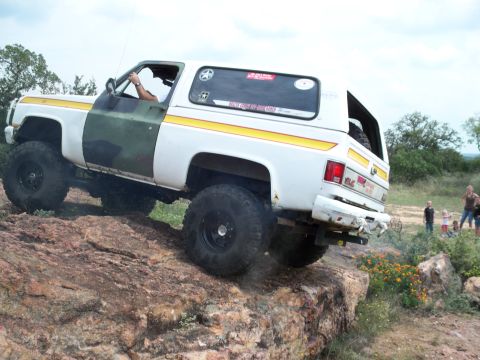 1996 Ford Bronco - This modified SUV navigates a rocky trail, its off-road capabilities.