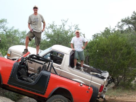 1996 Ford Bronco - Two men pose atop their vehicles during an off-road excursion.