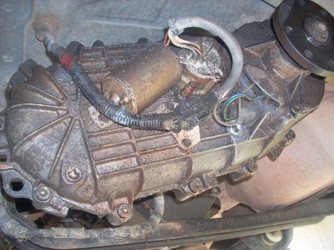 1992 Ford Bronco - Close-up view of a vehicle's transfer case, showing its mechanical components and wiring.