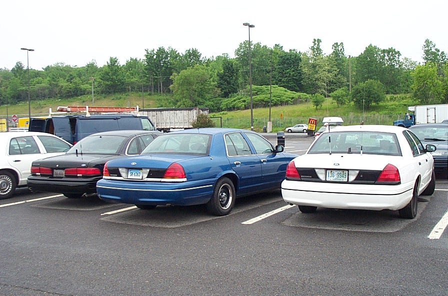 Blue 1991 Ford Crown Victoria LTD sedan, rear view, parked in lot