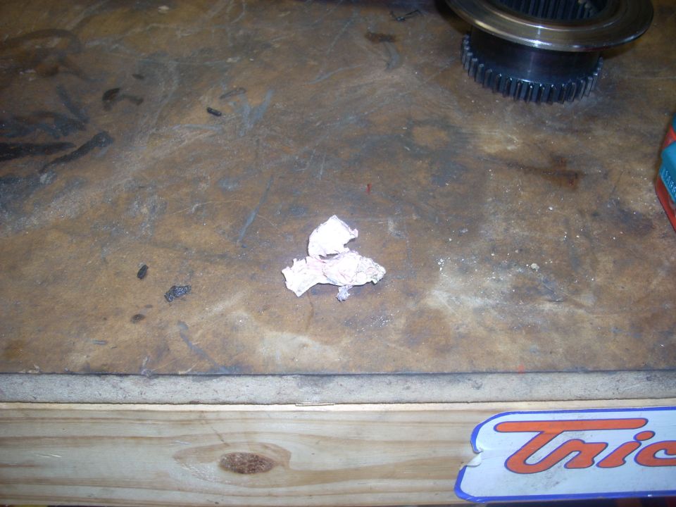 Transfer case gear on workbench with paper towel