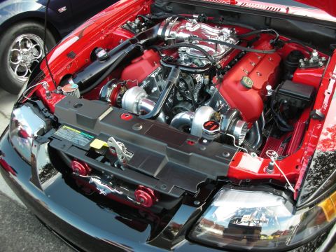 1998 Ford Crown Victoria - Custom twin-turbo V8 engine bay with polished components and red accents.