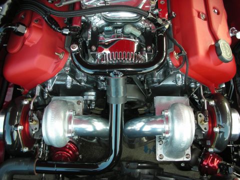 1998 Ford Crown Victoria - Close-up of a custom twin-turbocharged V8 engine, likely modified.