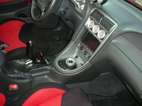 1998 Ford Crown Victoria - Interior view of a car with custom racing seats and auxiliary gauges.