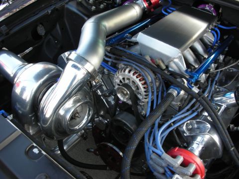 1998 Ford Crown Victoria - Custom turbocharged V8 engine with polished components and vibrant blue wiring.