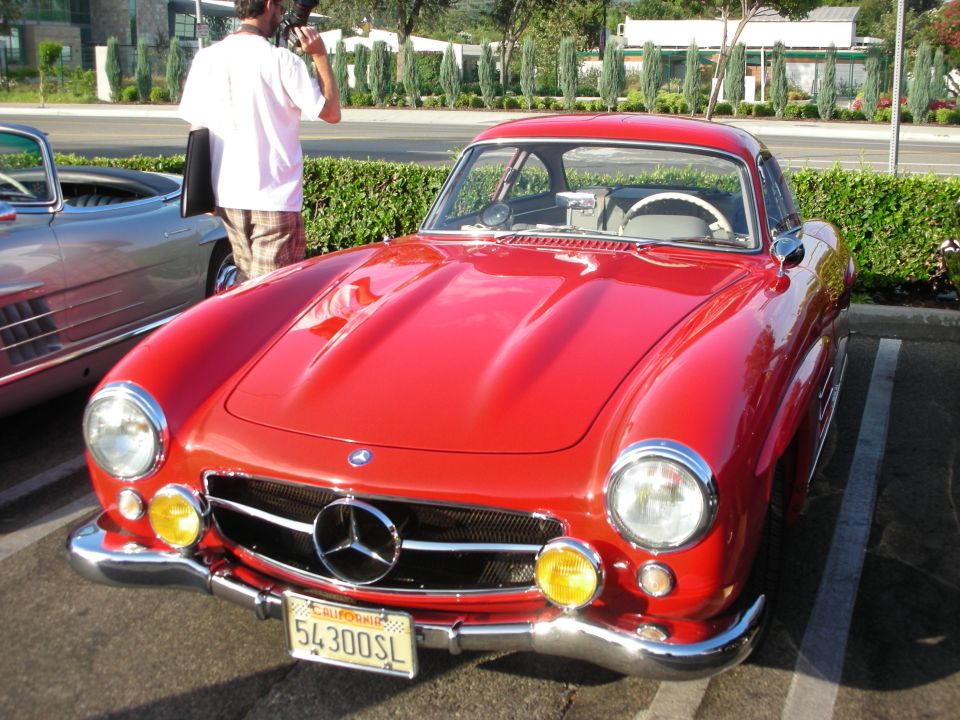 Red Mercedes-Benz 300SL coupe front view with yellow fog lights and California plate 54300SL