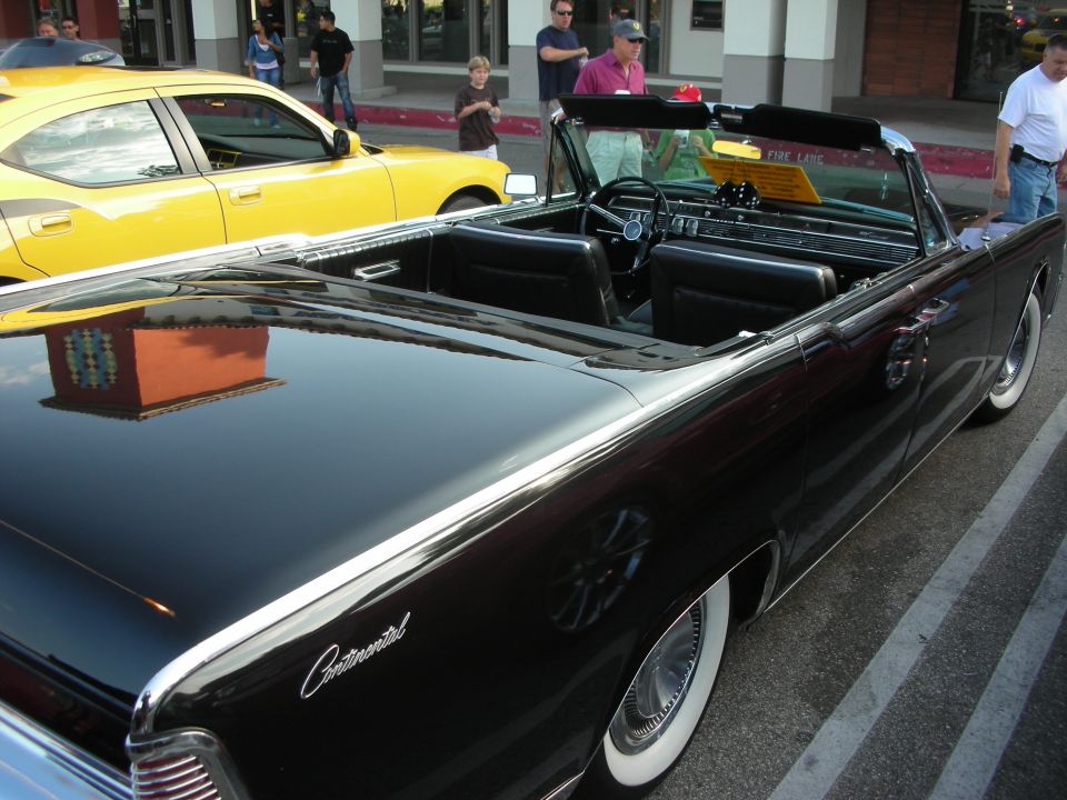 Black convertible rear quarter view with Continental script on fender