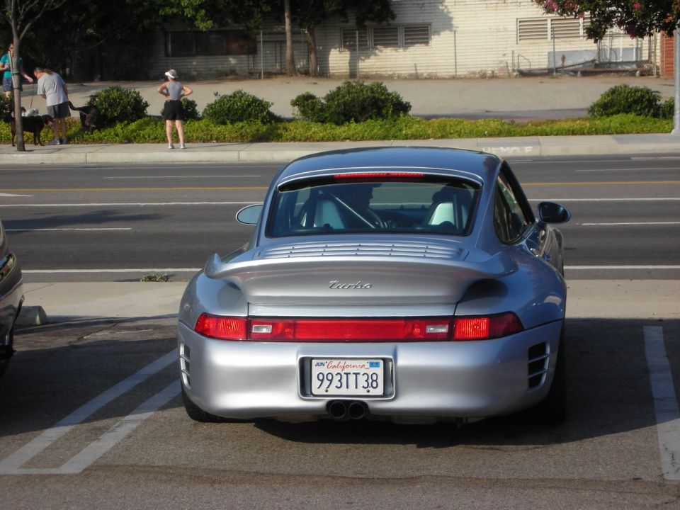 Silver Porsche 911 Turbo rear view with California plates