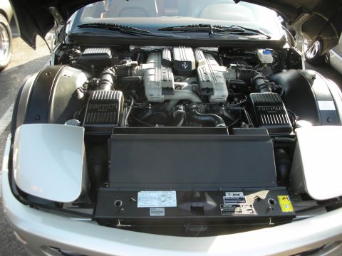 1998 Ford Crown Victoria - Close-up view of a Ferrari V8 engine bay, showing intricate mechanical components.