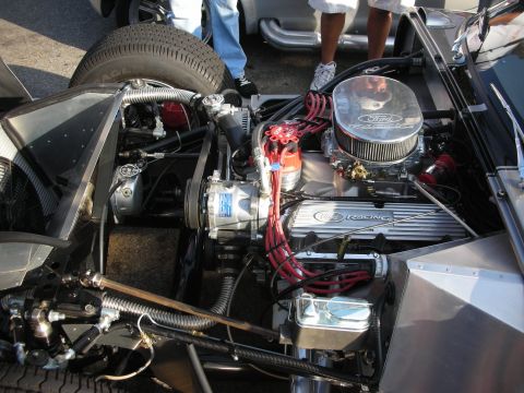 1998 Ford Crown Victoria - The engine bay of a custom vehicle, a Ford Racing V8 engine and various components.