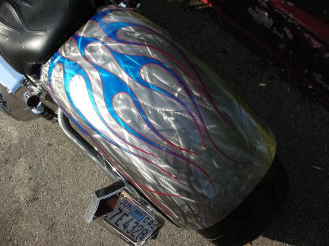 1998 Ford Crown Victoria - Custom painted motorcycle fender with flame graphics and a California license plate.