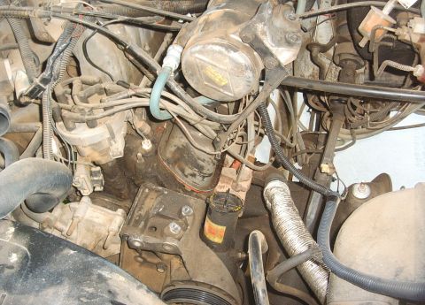 1987 Ford Bronco - Picture of the A/C moved out of the way exposing old pump.