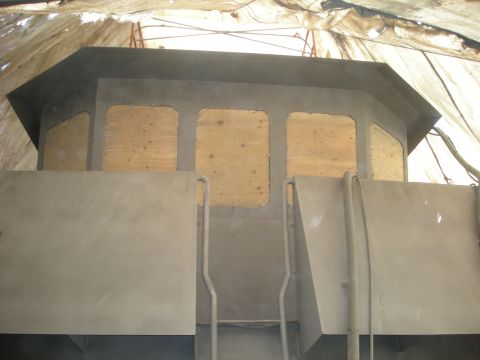 1991 Ford Bronco - This vehicle part appears to be under construction or repair, with windows boarded up.