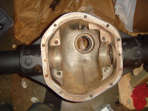 1992 Ford Bronco - Close-up of a vehicle's differential housing, revealing its internal gears and connection to the drive shaft.
