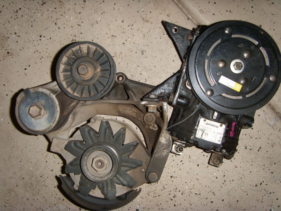 AC compressor, alternator, and belt tensioner assembly