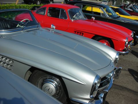 1998 Ford Crown Victoria - A lineup of vintage Mercedes-Benz cars parked together, their classic designs.