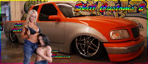 1991 Ford Crown Victoria - A customized orange and silver pickup truck is shown with two women in a garage setting.