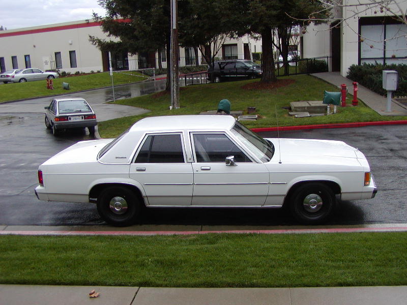 White 1991 Ford Crown Victoria LTD sedan, side view