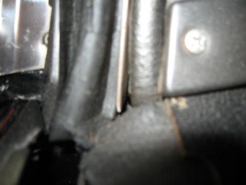 1968 Shelby GT500 - Detail of car interior trim, showing a screw and a worn rubber seal.