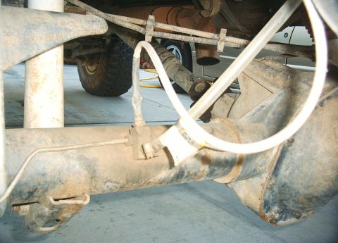 1987 Ford Bronco - Clear tubing used bought at Ace Hardware. This tubing contects to the front diff.
