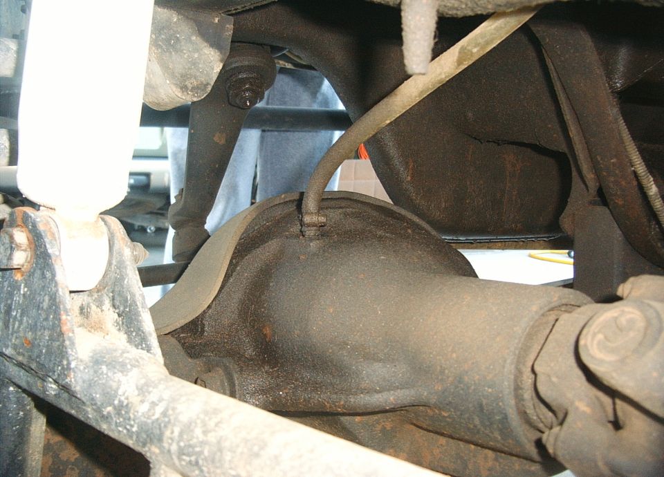 Underside view of a vehicle's differential housing and axle