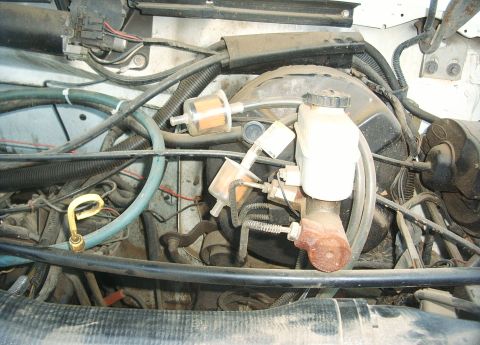 1987 Ford Bronco - Tubing hooked to two fuel filters bought at Ace Hardware.