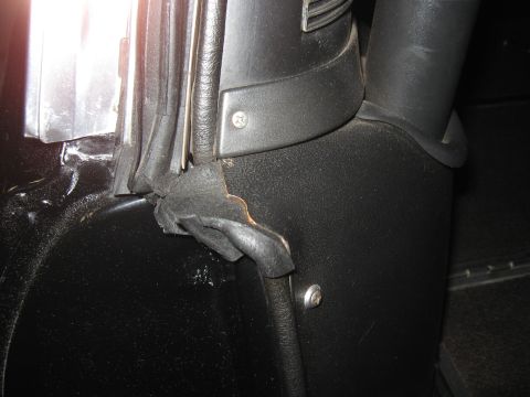 1968 Shelby GT500 - Detail of worn interior trim and a damaged rubber seal on a vehicle.