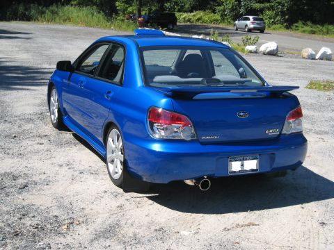 2007 Subaru Impreza - This blue 2007 Subaru Impreza WRX sedan features a distinctive roof vent and a rear spoiler.