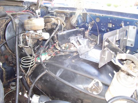 1991 Ford Bronco - Close-up view of engine bay components including brake lines and electrical wiring.