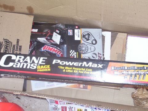 1991 Ford Bronco - A box containing various engine performance parts, including a Crane Cams PowerMax cam and lifter kit.