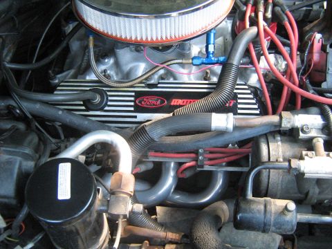 1988 Mercury Grand Marquis - Close-up view of a Ford Motorsport engine, showing valve covers and various hoses and wiring.
