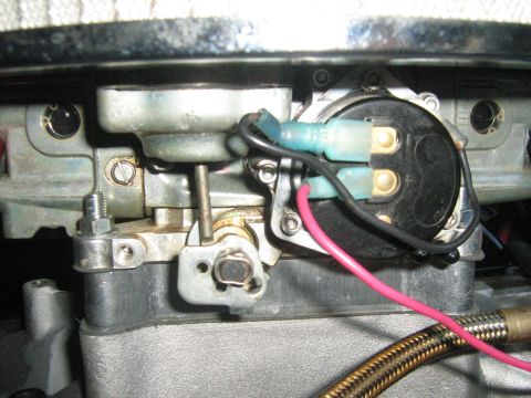 1988 Mercury Grand Marquis - Electrical connections are attached to a carburetor, showing wiring and terminals.