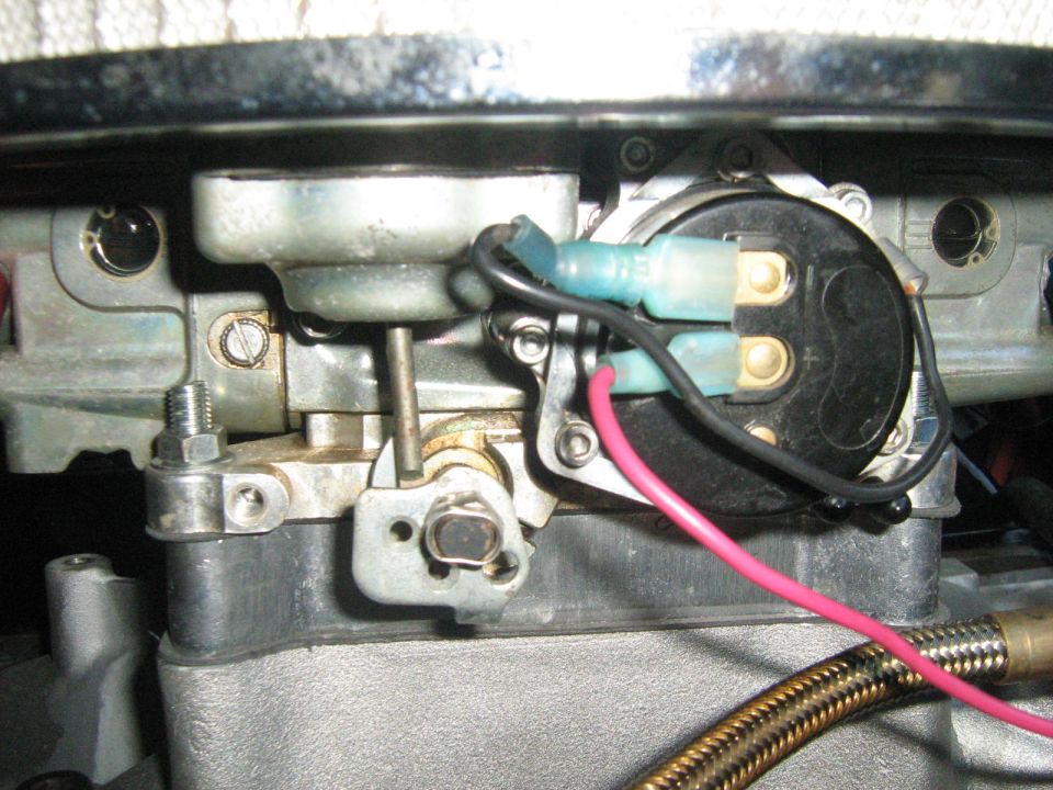 Close-up of electrical connectors on a carburetor