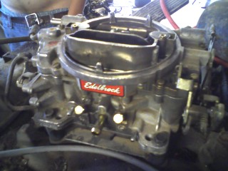 1979 Ford Bronco - Close-up of an Edelbrock carburetor, the SuperMotors logo at the bottom.