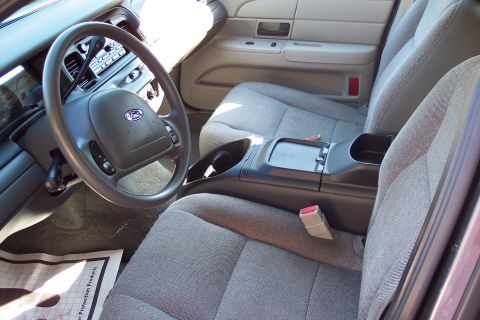 2001 Ford Crown Victoria - Interior view of a 2001 Ford Crown Victoria, showing the dashboard, steering wheel, and front seats.