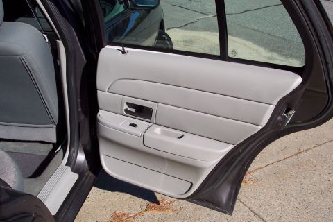 2001 Ford Crown Victoria - Rear passenger door panel and seat of a 2001 Ford Crown Victoria.