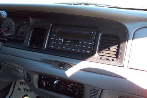 2001 Ford Crown Victoria - Interior view of a 2001 Ford Crown Victoria dashboard, showing the radio and climate controls.