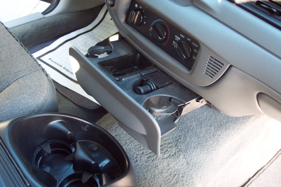 2001 Ford Crown Victoria interior center console with cup holders and climate controls