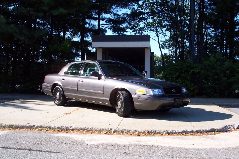 Gray 2001 Ford Crown Victoria sedan parked on a concrete pad