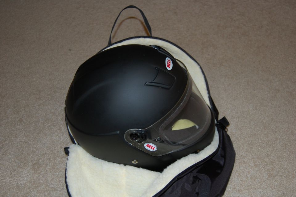 Black Bell helmet with clear visor inside a padded bag