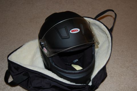 2002 BMW M3 - A black Bell helmet with a clear visor rests inside a padded black bag.