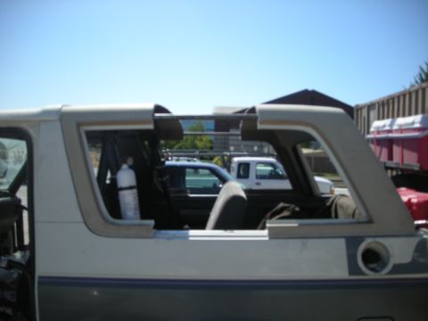1991 Ford Bronco - This 1991 Ford Bronco is seen from the side with its removable top off, revealing the interior and a fire extinguisher.