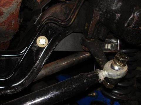 1996 Ford F-150 - Detail of a vehicle's suspension system, showing a tie rod end and associated hardware.